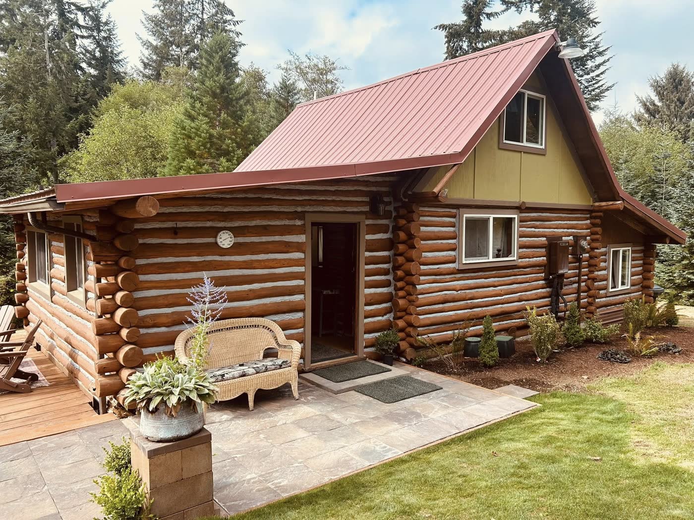 The log cabin with its red roof